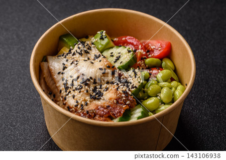 An Asian style bowl with eel, edamame, avocado, tomatoes, and lettuce. A eel and vegetable bowl 143106938