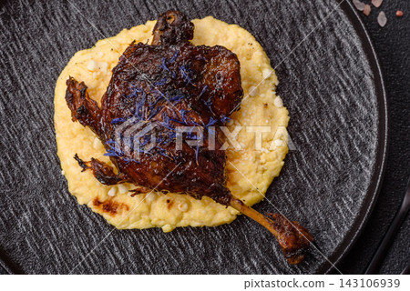 Duck leg confit roasted with salt and allspice. Duck leg confit Duck leg confit roasted with salt and allspice. Duck leg confit 143106939