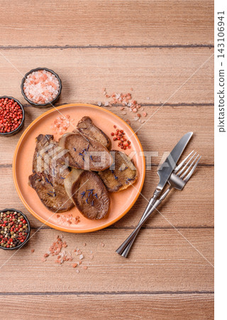 Slices of grilled pork or beef tongue seasoned with salt and allspice. Sliced beef tongue Slices of grilled pork or beef tongue seasoned with salt and allspice. Sliced beef tongue 143106941