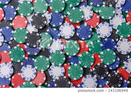 Multi colored gaming chips for betting in casino games. Betting chips Multi colored gaming chips for betting in casino games. Betting chips 143106949