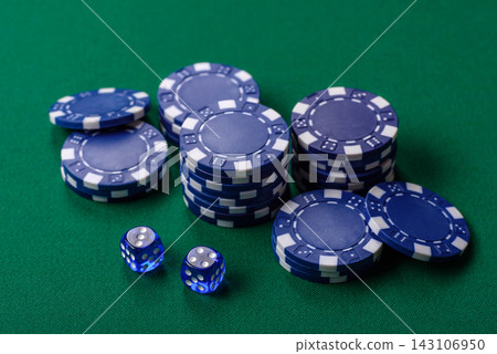 Multicolored casino chips as a conceptual backdrop for gambling games like poker, blackjack Multicolored casino chips as a conceptual backdrop for gambling games like poker, blackjack 143106950