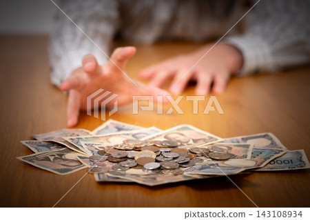 A man reaching for money - dark A man reaching for money - dark 143108934