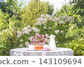 Summer breakfast in the sunny blooming garden 143109694