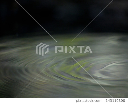 The shimmering surface patterns of rainwater barrels: an abstract expression capturing light and color. The shimmering surface patterns of rainwater barrels: an abstract expression capturing light and color. 143110808
