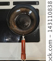 Cast iron frying pan on an induction cooktop 143110838