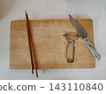 Cooking utensils placed on a cutting board 143110840