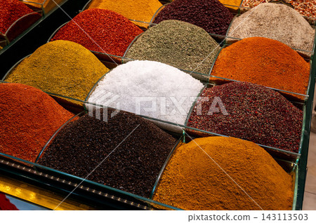 Istanbul,turkey,august 4, 2025. Various vibrant spices and condiments arranged in mounds at a market stall in istanbul, offering rich flavors and aromas Istanbul,turkey,august 4, 2025. Various vibrant spices and condiments arranged in mounds at a market stall in istanbul, offering rich flavors and aromas 143113503