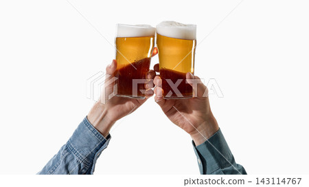 Hands raising two beer glasses for celebration toast. Hands raising two beer glasses for celebration toast. 143114767