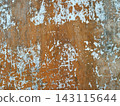 Weathered wall texture featuring peeling paint, layered patina, and aged details.  143115644