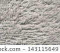 Blurred gray fabric texture forming a soft abstract surface 143115649