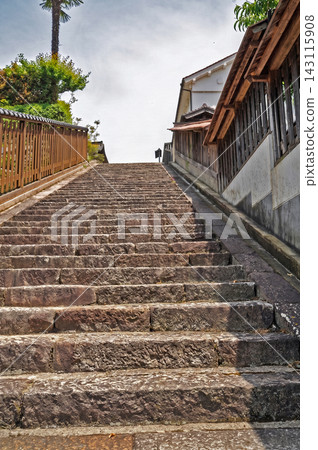 A long stone staircase nestled between retro-style houses. A long stone staircase nestled between retro-style houses. 143115908