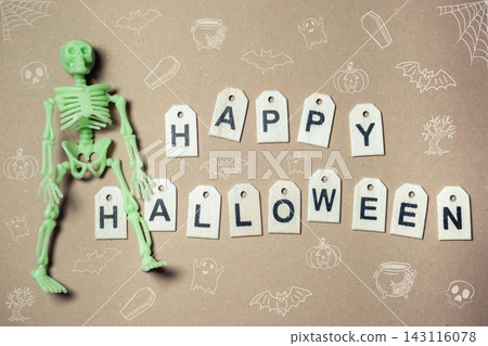 Halloween Skeleton and Letter Tags on Brown Background Halloween Skeleton and Letter Tags on Brown Background 143116078