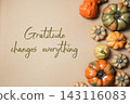 Decorative Pumpkins with Gratitude Message on Brown Background 143116083