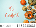 Autumn Pumpkins with Be Grateful Message on Blue Background 143116088