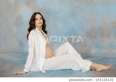 Expectant Mother Embracing Pregnancy Journey Expectant Mother Embracing Pregnancy Journey 143116116