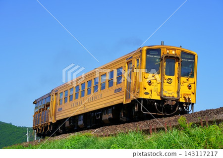 The Shimanto Torokko, a yellow trolley train that runs along the Shimanto River basin. The Shimanto Torokko, a yellow trolley train that runs along the Shimanto River basin. 143117217