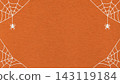 Halloween spider web frame with hanging spiders on dark orange textured paper background. Spooky border banner with copy space 143119184