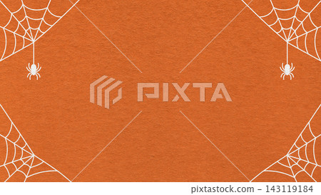 Halloween spider web frame with hanging spiders on dark orange textured paper background. Spooky border banner with copy space 143119184