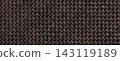 Dark brown woven textile texture background, macro. Structure of chocolate fabric material backdrop with weave pattern 143119189