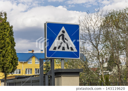 Pedestrian Crossing Road Sign Against Blue Sky and Trees Pedestrian Crossing Road Sign Against Blue Sky and Trees 143119620