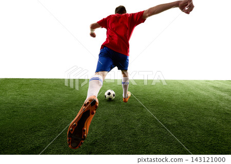 Player following through after long range football shot Player following through after long range football shot 143121000