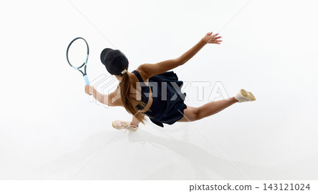 Top view of female tennis player leaping sideways with extended racket Top view of female tennis player leaping sideways with extended racket 143121024