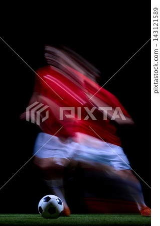 Abstract motion trail around young player controlling soccer ball Abstract motion trail around young player controlling soccer ball 143121589