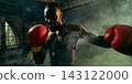 Confident fighter throws a powerful punch through gym smoke with competitive excitement Confident fighter throws a powerful punch through gym smoke with competitive excitement 143122000