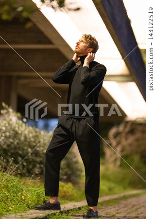Man looking up contemplative outdoor urban architecture Man looking up contemplative outdoor urban architecture 143122519