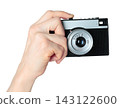 Hand holding retro photo camera isolated on transparent background, front view, retro things concept 143122600