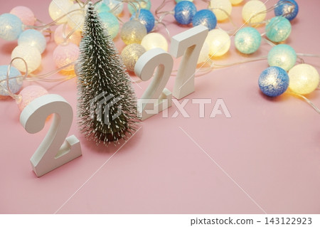 Happy New Year 2027 festive background with space on pink background Happy New Year 2027 festive background with space on pink background 143122923