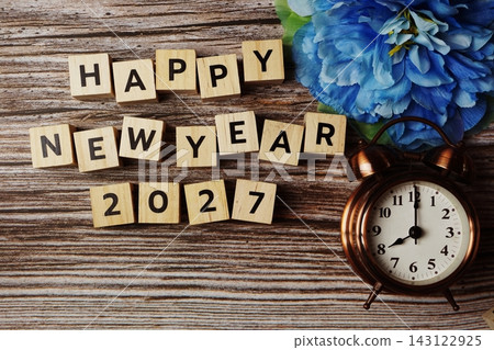 Happy New Year 2027 with alarm clock on wooden background Happy New Year 2027 with alarm clock on wooden background 143122925