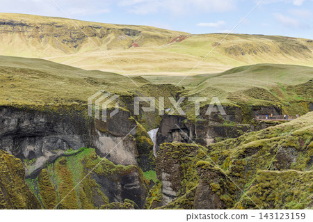 Mogafoss waterfall amid moss covered cliffs of Fjadrargljufur canyon, Iceland Mogafoss waterfall amid moss covered cliffs of Fjadrargljufur canyon, Iceland 143123159