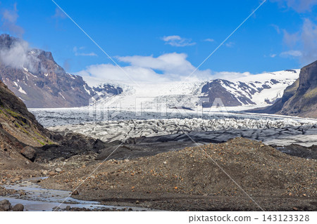 Skaftafellsjokull Glacier and Rocky Moraine in Scenic Icelandic Mountain Valley Skaftafellsjokull Glacier and Rocky Moraine in Scenic Icelandic Mountain Valley 143123328