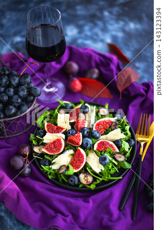 Delicious fresh figs, blueberries, Camembert cheese, and arugula salad Delicious fresh figs, blueberries, Camembert cheese, and arugula salad 143123394