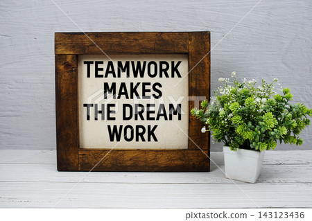 Teamwork Makes the Dream Work text written on wooden board Teamwork Makes the Dream Work text written on wooden board 143123436