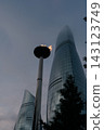 Baku Flame Towers stand tall with a flame at sunset illuminating the skyline of Baku city 143123749