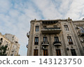 Beautiful balconies of high-rise buildings shot from the bottom up against the sky in Baku 143123750