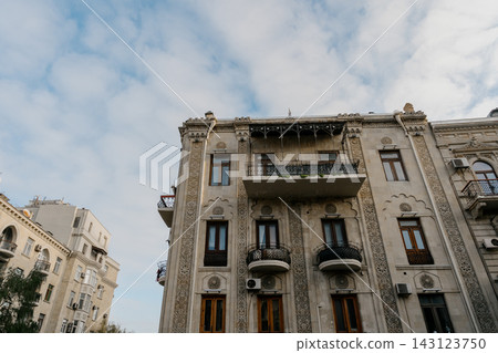 Beautiful balconies of high-rise buildings shot from the bottom up against the sky in Baku 143123750