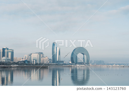 View of Baku embankment and Crescent Hotel by the sea in Azerbaijan at different times of the day 143123760