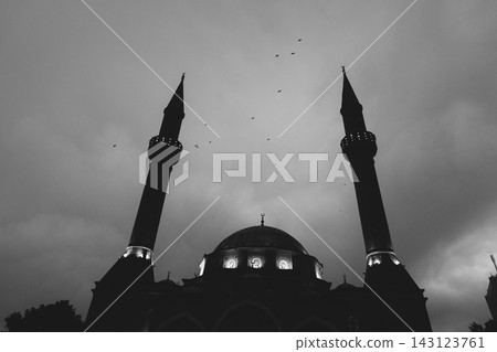 Baku Mosque of the Martyrs stands against the cloudy sky during dusk, black and white photo Baku Mosque of the Martyrs stands against the cloudy sky during dusk, black and white photo 143123761