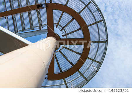 Underside view of geometric glass and metal architecture framework Underside view of geometric glass and metal architecture framework 143123791