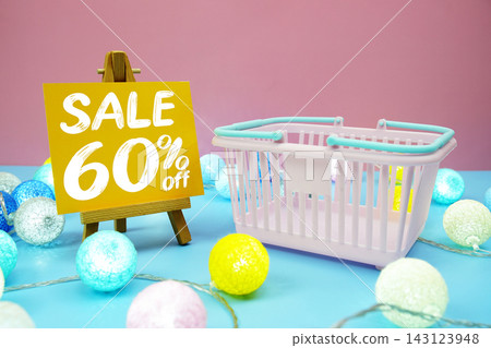 Sale 60% text with shopping basket on blue background Sale 60% text with shopping basket on blue background 143123948