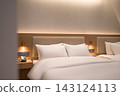 Modern and Cozy Hotel Room Interior with Twin Beds and Warm Lighting 143124113