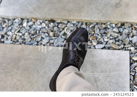 Man Wearing Brown Leather Oxford Shoe While Walking Outdoors1 Man Wearing Brown Leather Oxford Shoe While Walking Outdoors1 143124523