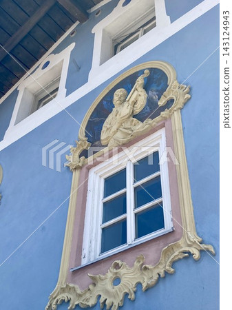 Blue house facade with a traditional angel fresco painting in Mittenwald, Bavaria, Germany Blue house facade with a traditional angel fresco painting in Mittenwald, Bavaria, Germany 143124943