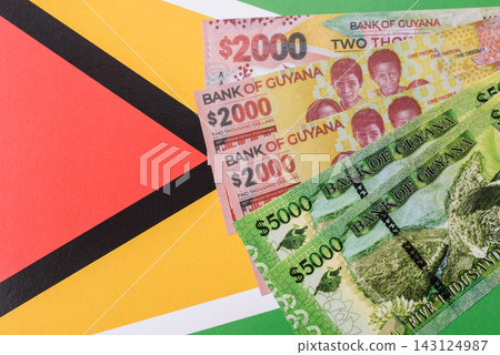 Guyana paper money, dollar banknotes and coins as currency for exchange or travel Guyana paper money, dollar banknotes and coins as currency for exchange or travel 143124987