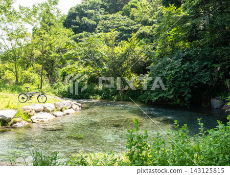 Image of fresh green forest, clear stream, and cycling: Jizo Falls Spring Image of fresh green forest, clear stream, and cycling: Jizo Falls Spring 143125815