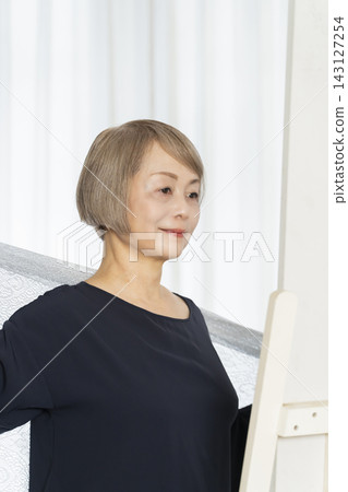Senior women choosing scarves to dress stylishly Senior women choosing scarves to dress stylishly 143127254