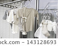 Baby clothes drying on the balcony 143128693